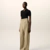 Beigefarbene Hose Aus Schurwolle Mit Hoher Taille Und Weitem Bein
